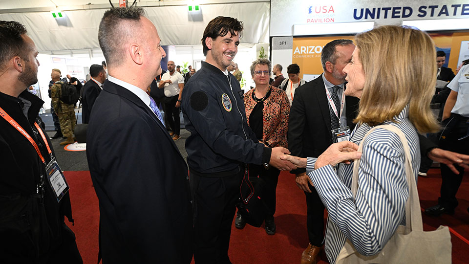 Sam Nikolsky being presented with his bomber jacket by American Ambassador to Australia Caroline Kennedy at the recent Avalon Airshow. 