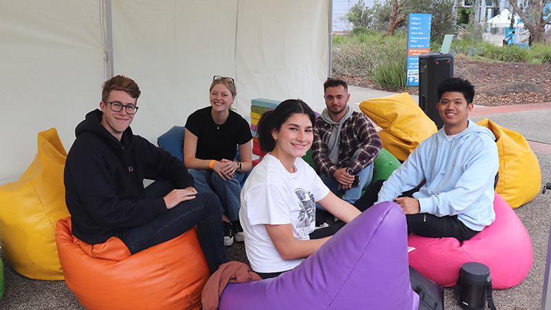 Students sitting on coloured beanbags at St Albans campus