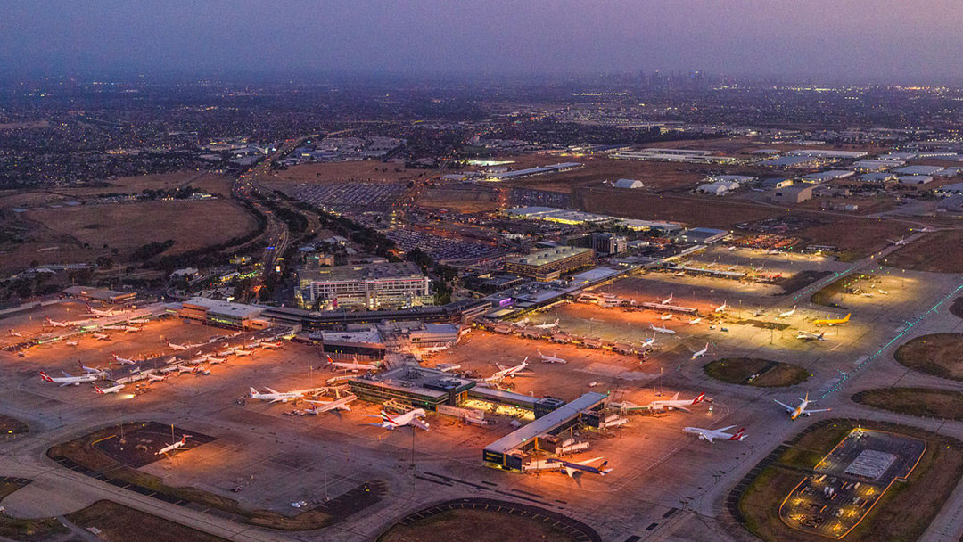 A large airport from above at dusk