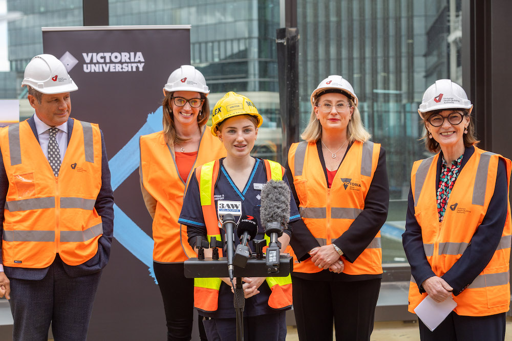People standing at a press conference at Footscray Hospital construction site