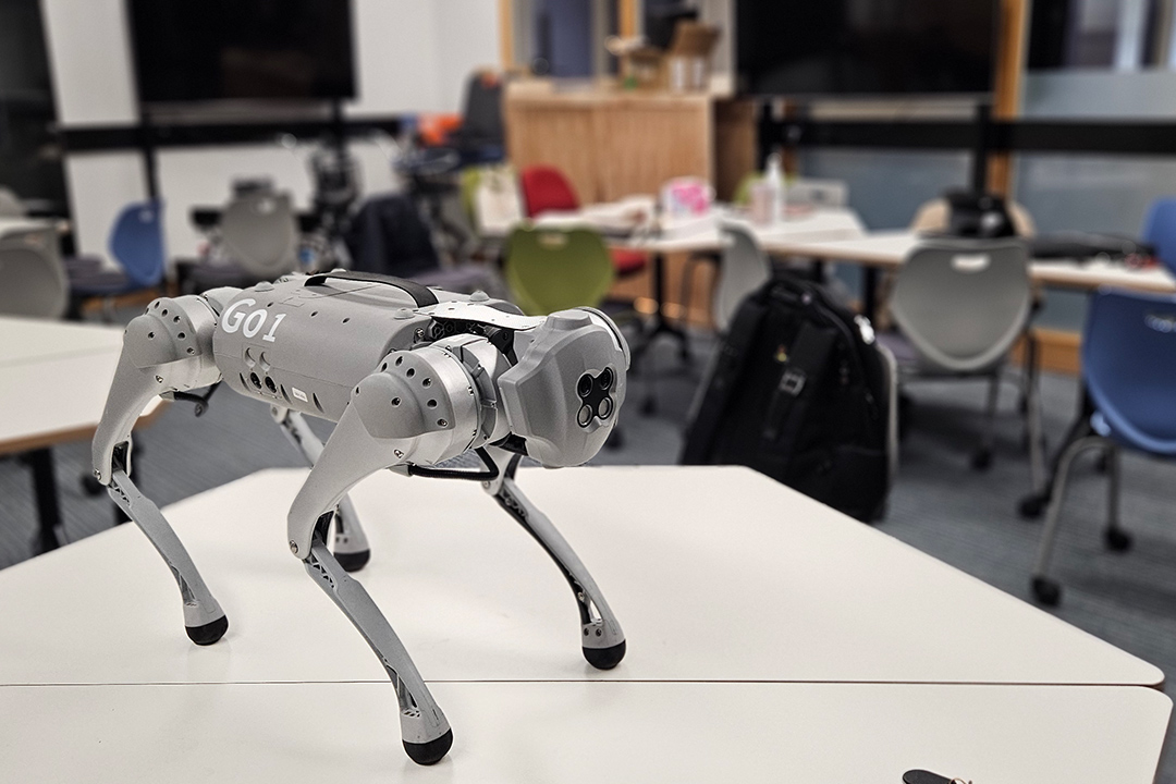 A silver robotic dog on a table