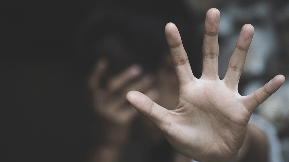 abstract image of person with hand outstretched to protect themselves