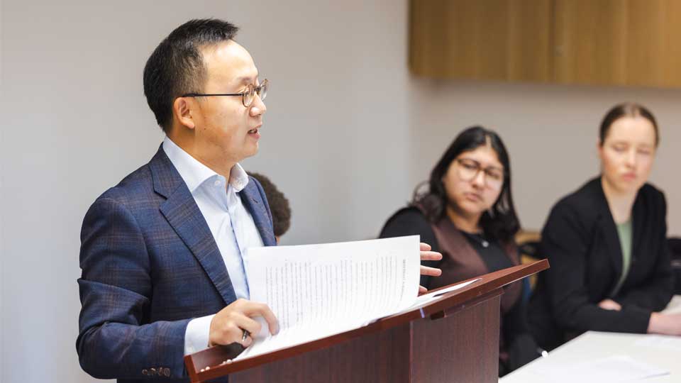 Allan Qiu presenting his submission at the moot court