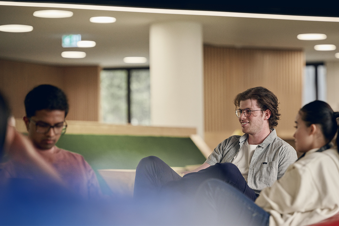 VU students relax together in a study space.