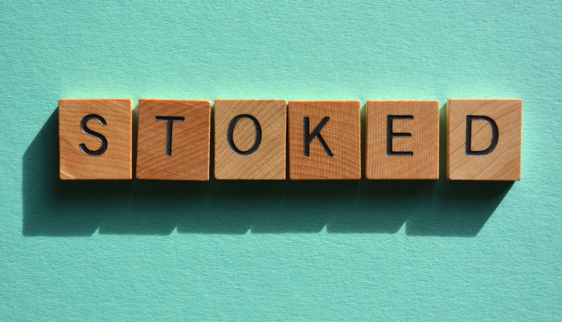 Wooden blocks that spell out the Australian slang word 'stoked'.