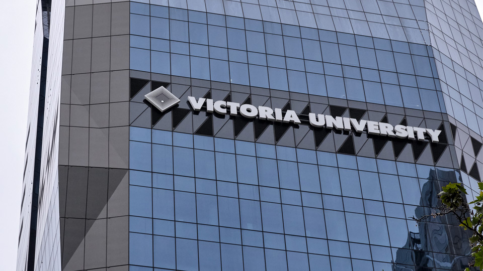 A photo of VU City Tower - featuring the Victoria University logo