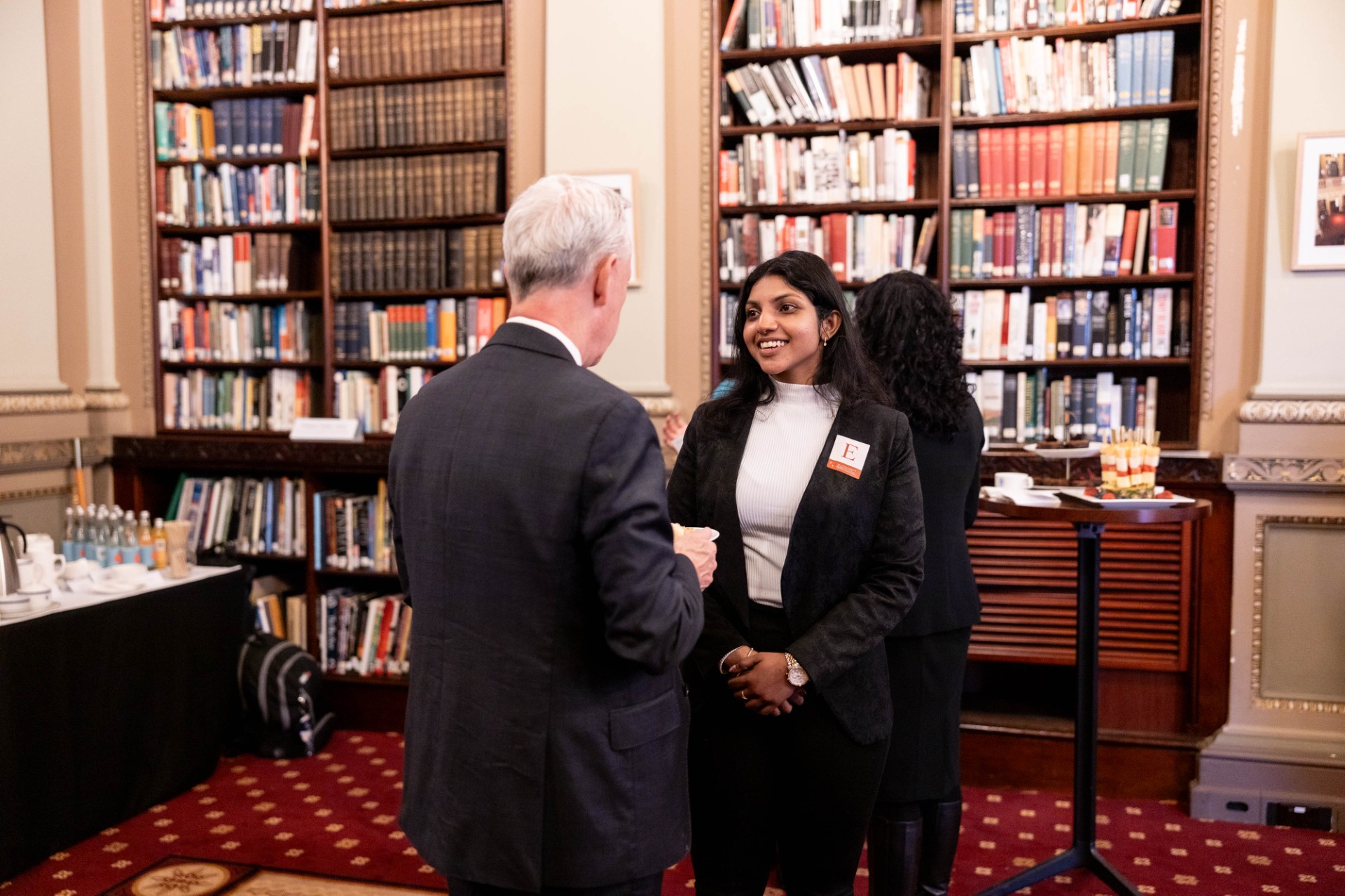 Adsheaya Vasakan speaking with Adam Shoemaker