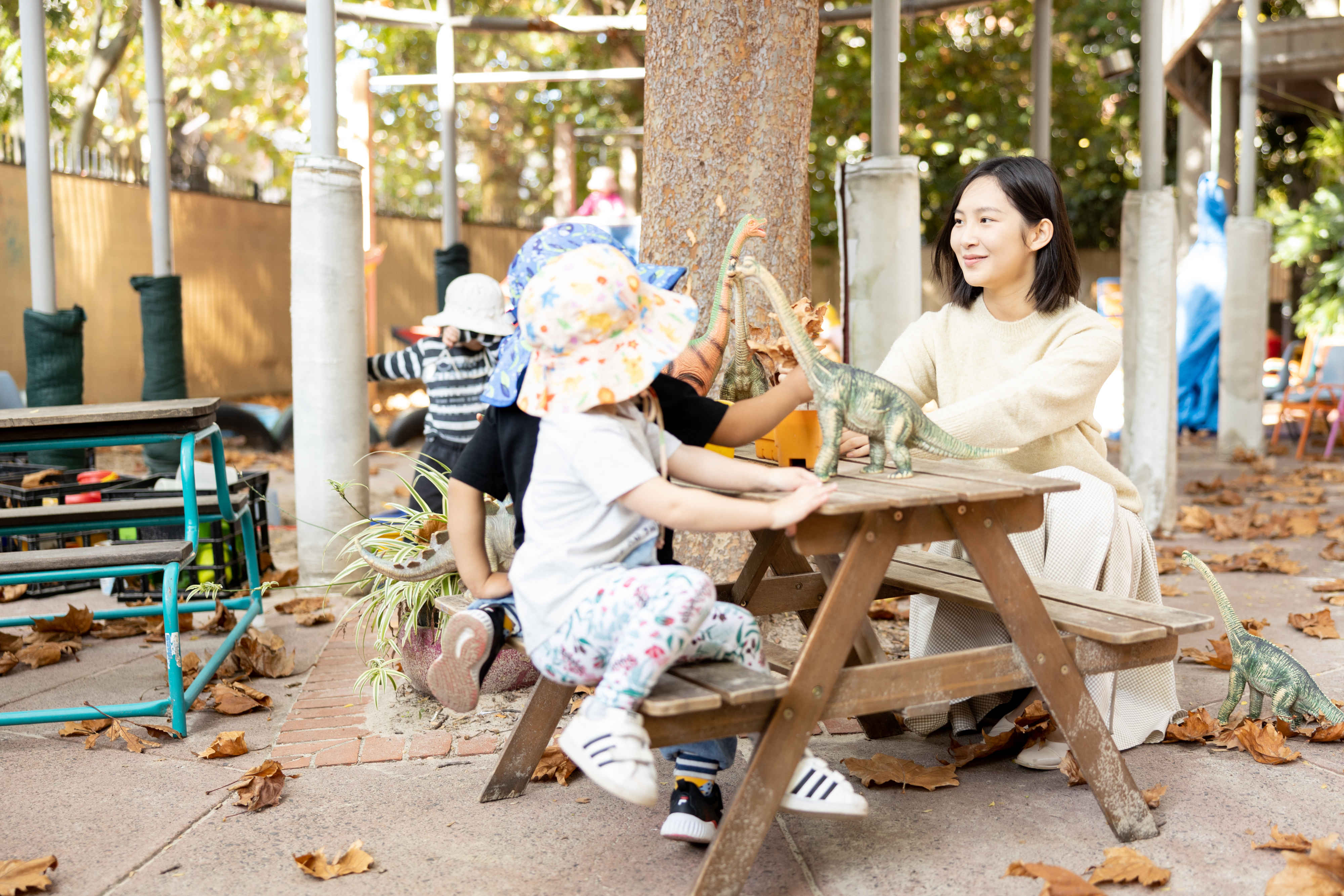 early childhood teacher playing with children