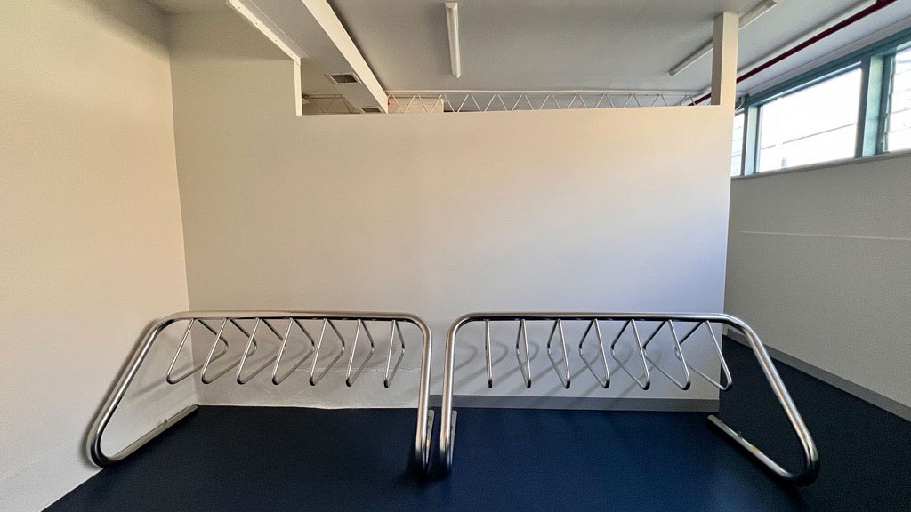 A room with a bike stand for securing bikes.