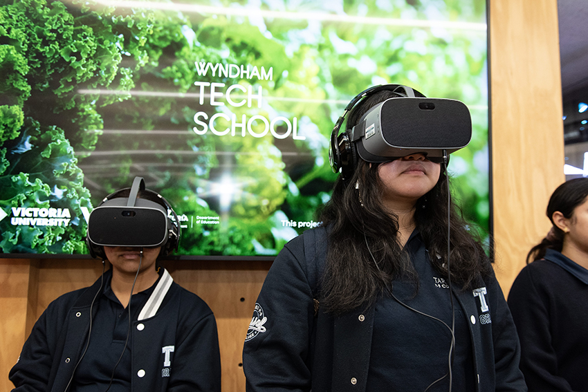 School girls with VR equipment on