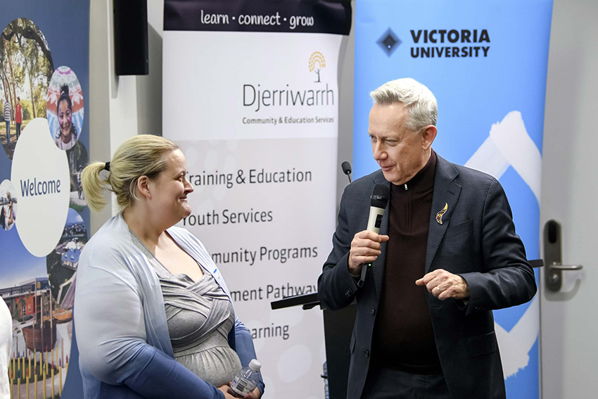 Student with VU Vice-Chancellor at an event