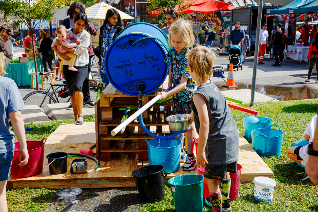 Children play with bright object outdoors