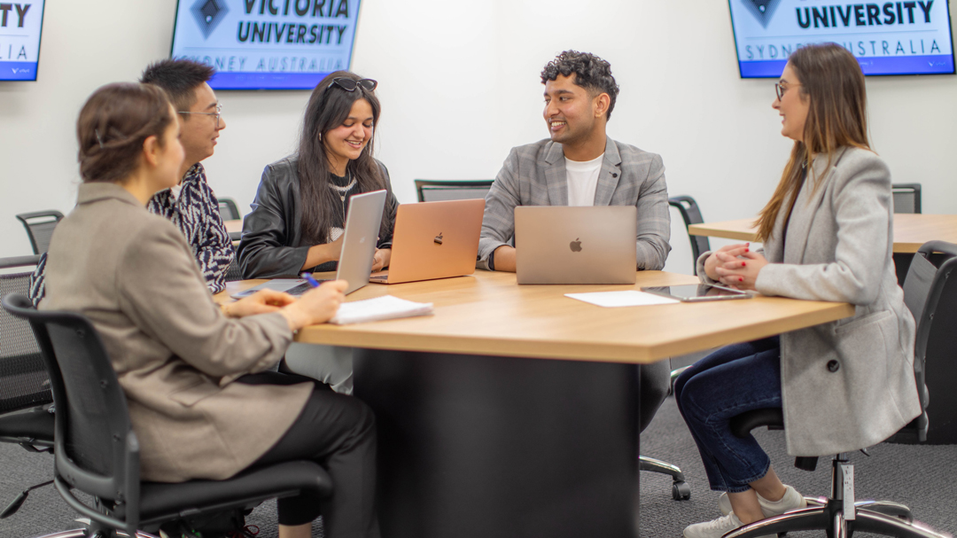 Group discussion around a table at VU Sydney
