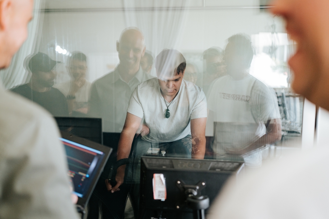 Research participant riding stationary bike in environmental chambers