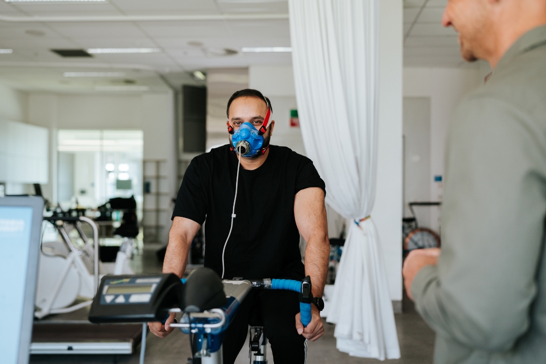 Research participant riding stationary bike for VO2 max test