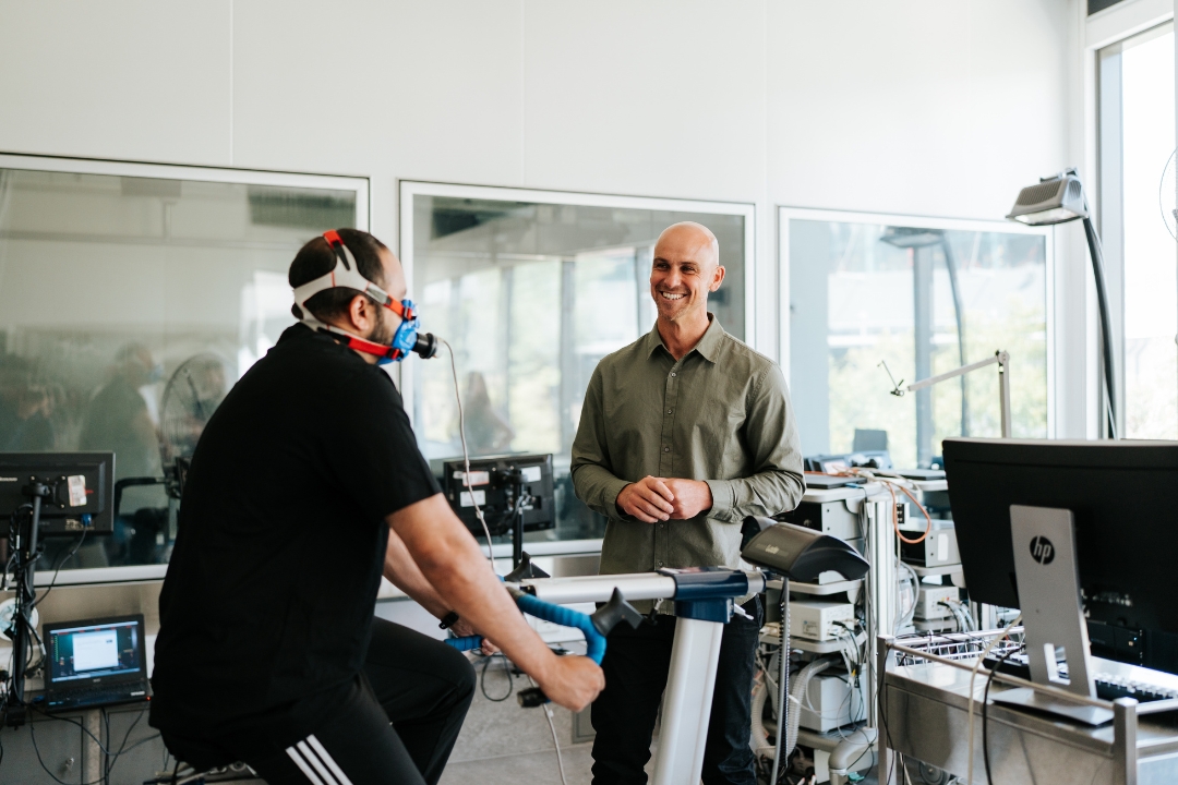 Researcher conducting VO2 max test