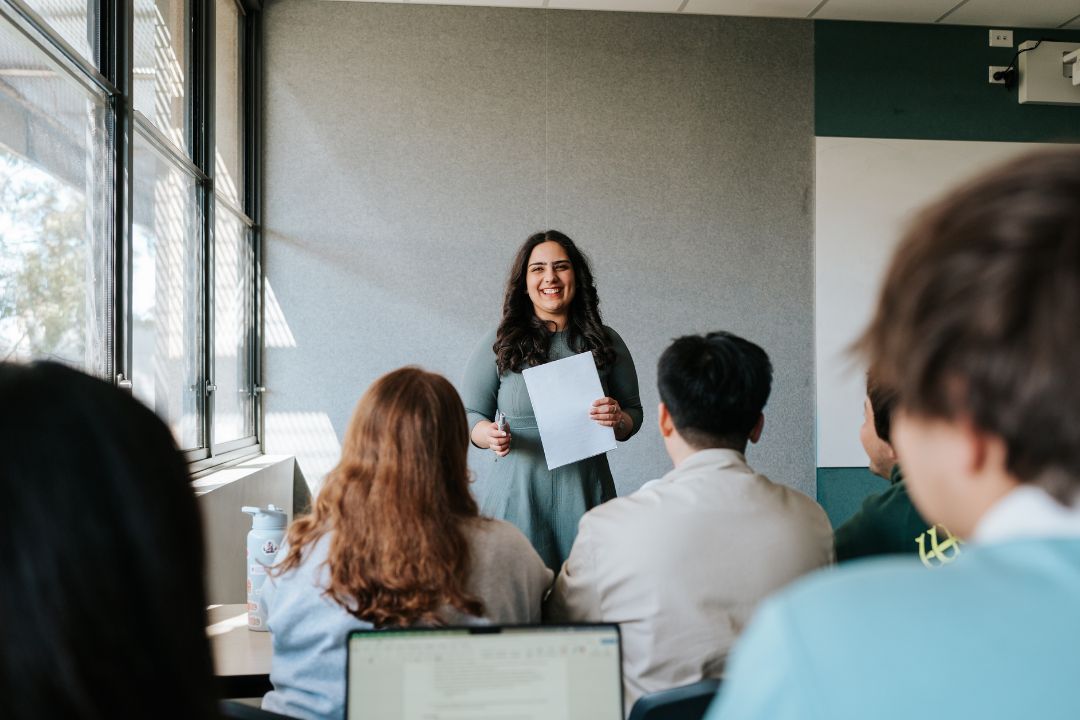 Teacher speaking in front of classroom