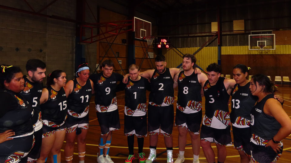 the VU team huddles before a basketball game