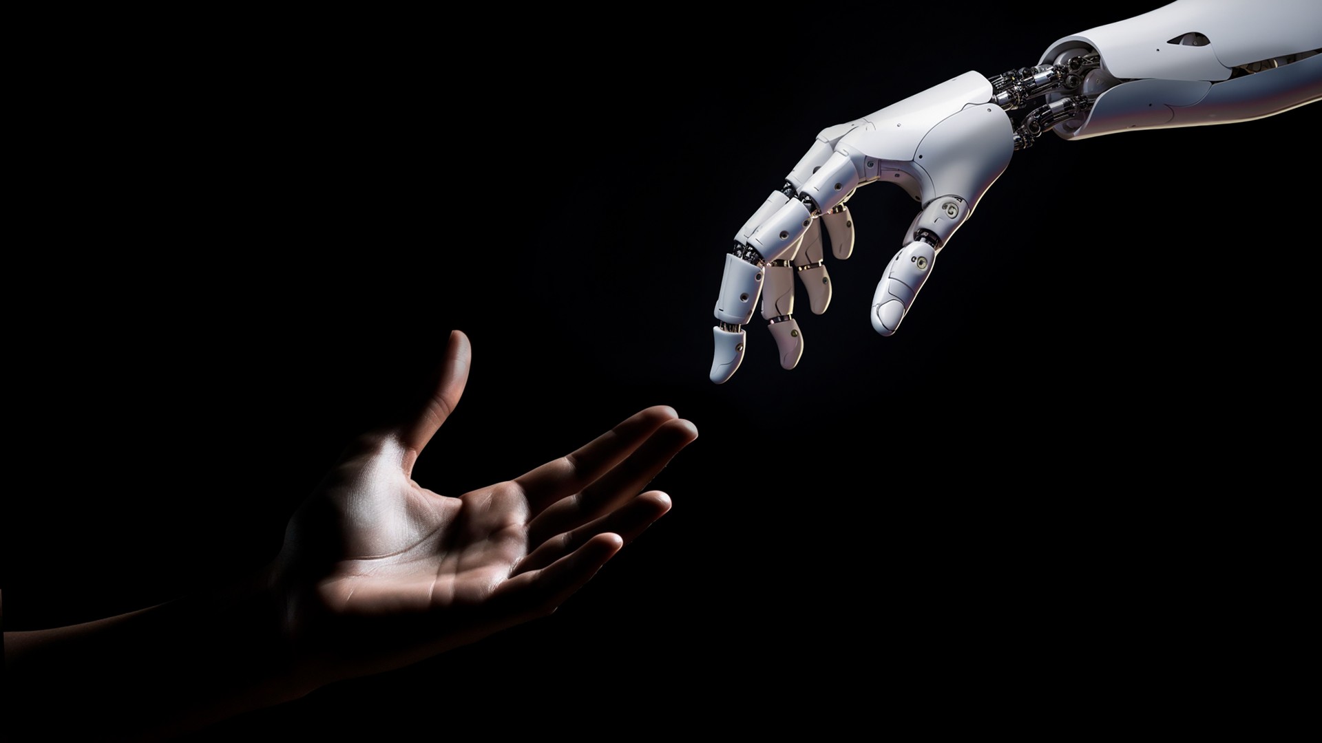 human-and-robot-hands-reaching-toward-each-other