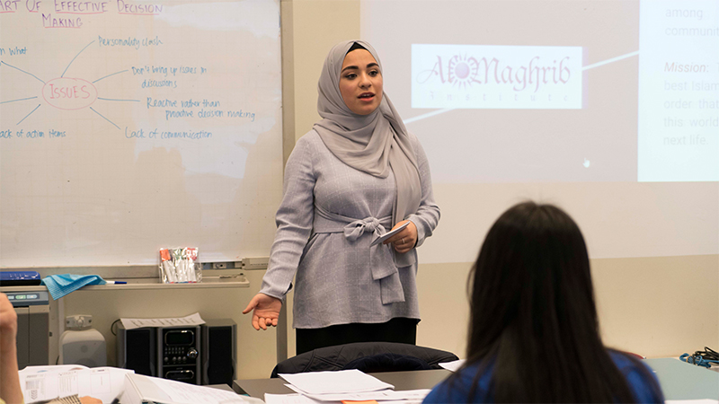  Photo of a program participant presenting to a group