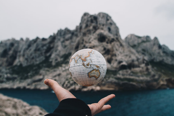 Ball representing earth in hand