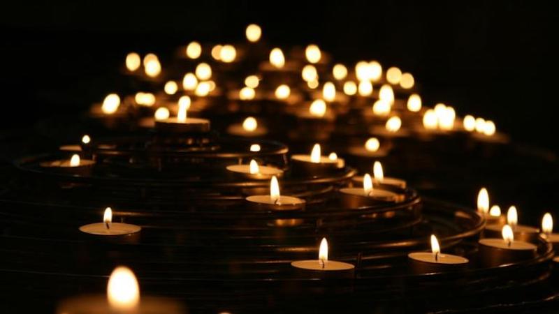 Lots of small candles burning.