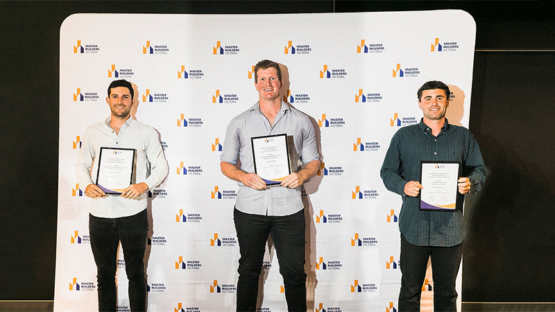 Aron Hutchison, Jake Tomlinson and Otto Opperman holding their awards.