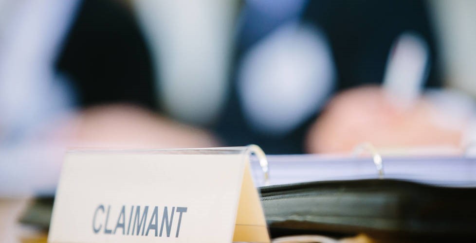 court proceedings; close up of 'Claimant' label