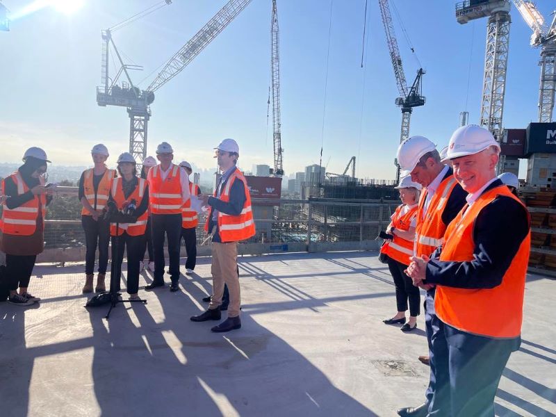  VU leaders with State Government officials in high vis on hospital construction site