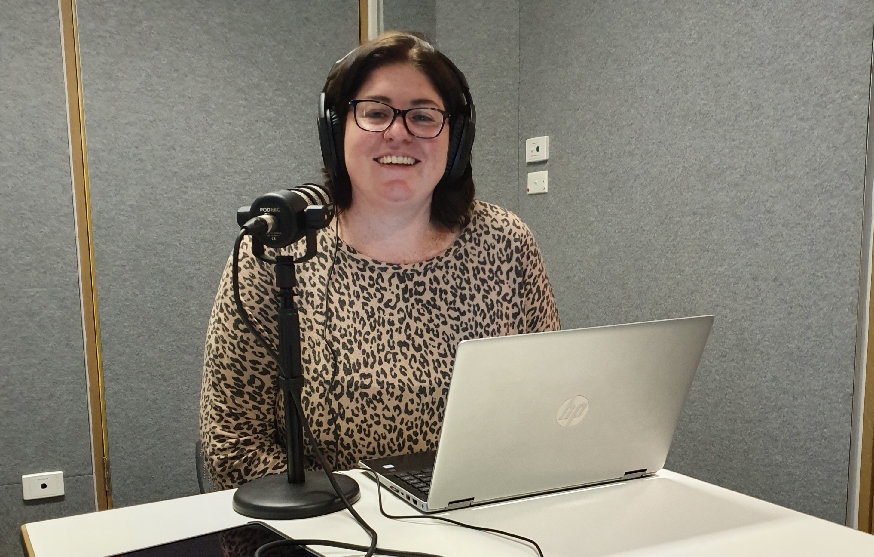 Lisa Higgins with her computer and microphone