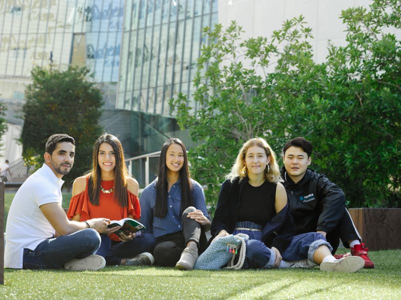 Students sitting on grass