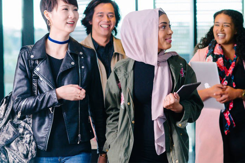 A group of students laughing together.