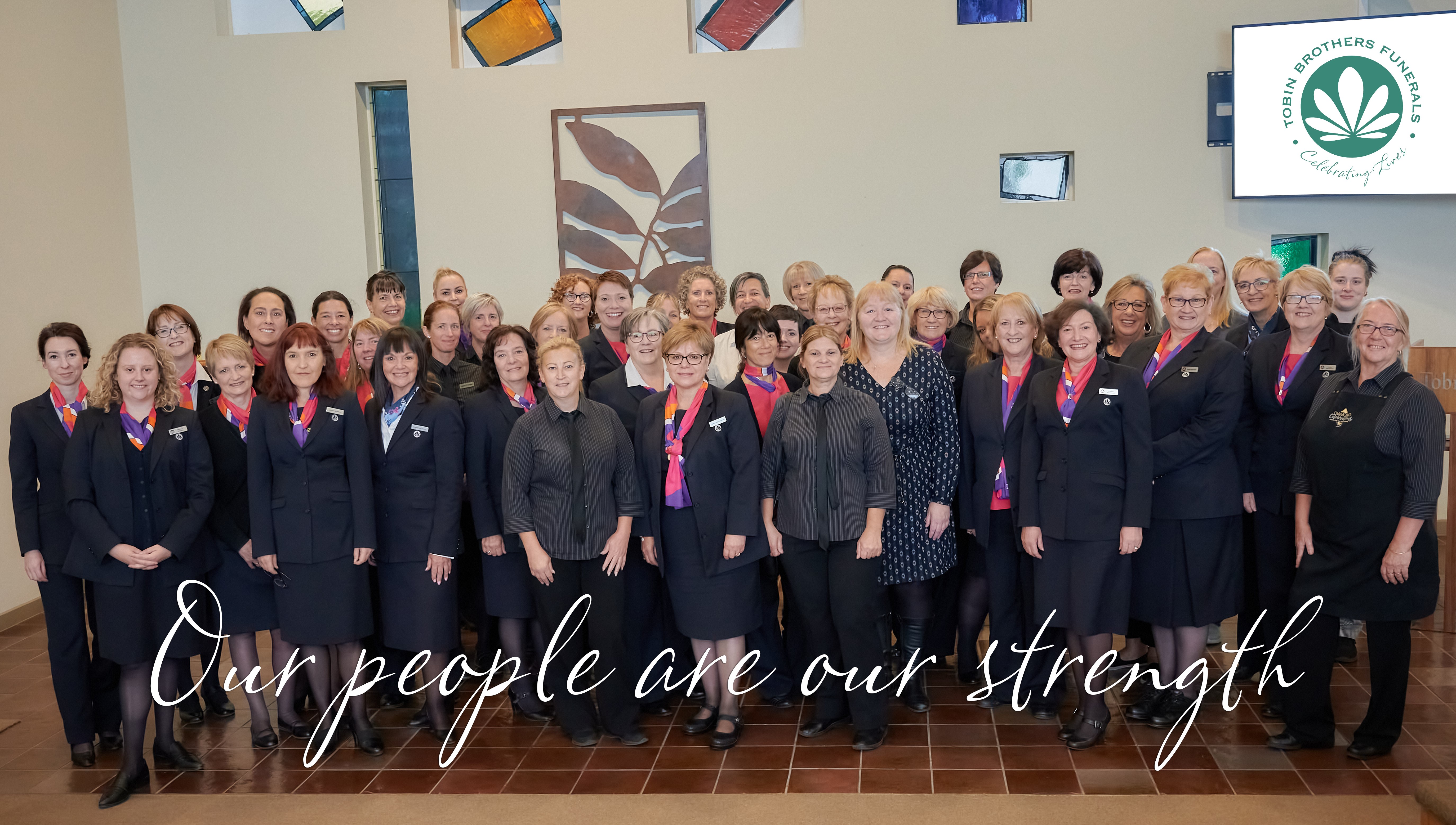 Staff of Tobin's with 'Our people are our strength' in text