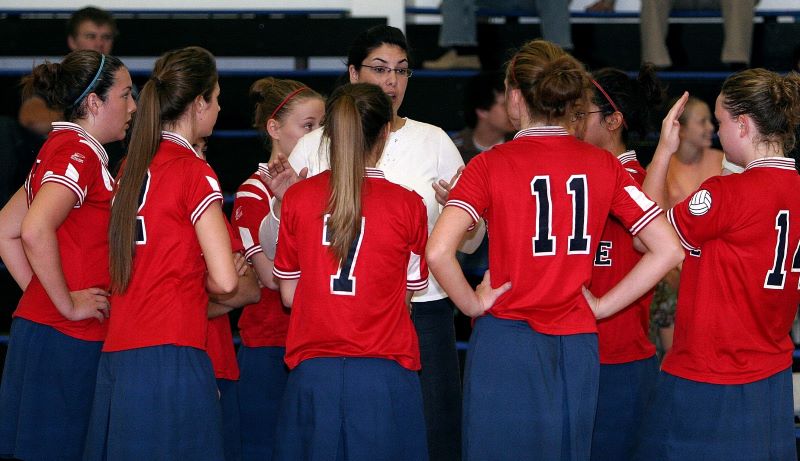 Girls volleyball team with coach