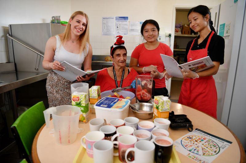 Nutrition student with client and staff from Footscray House