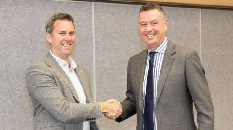 Handshake between Zac Lewis, CEO and Wade Noonan.