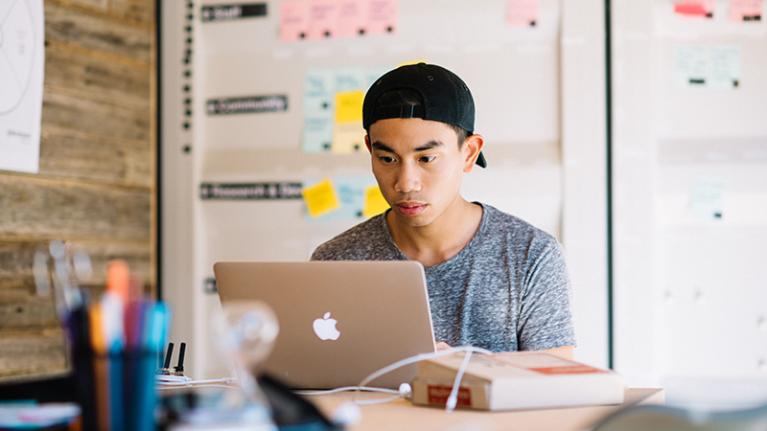 Engineering student studying on a laptop