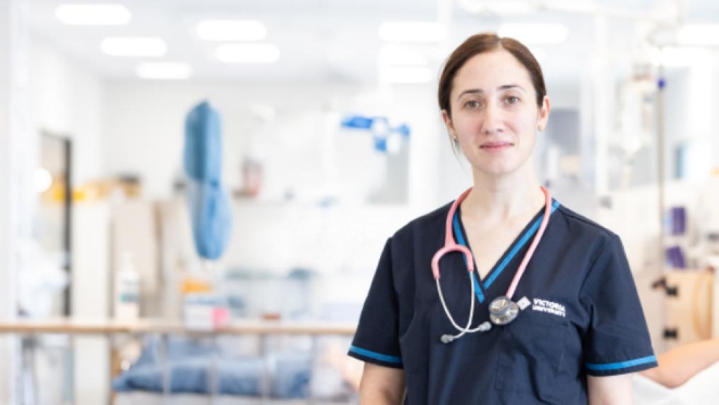 Young woman in a Victoria University nursing uniform and sethoscope, with