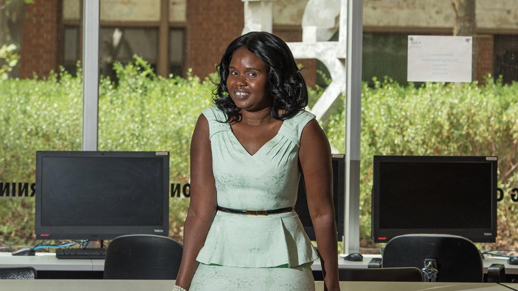 Young woman in profession clothes in computer lab