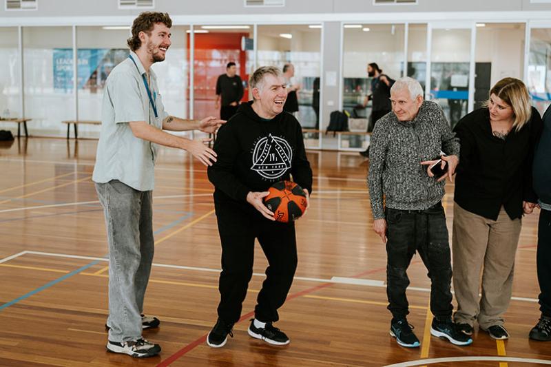 People playing basketball together.