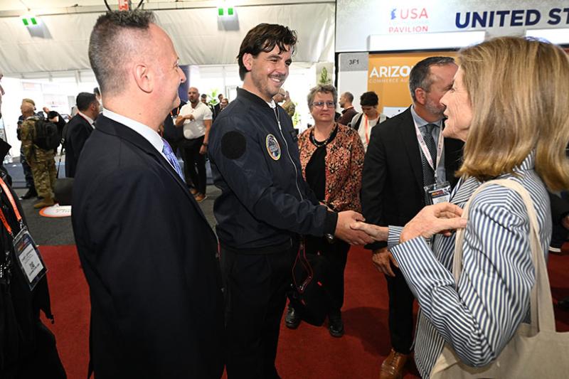 Sam Nikolsky being presented with his bomber jacket by American Ambassador to Australia Caroline Kennedy at the recent Avalon Airshow. 