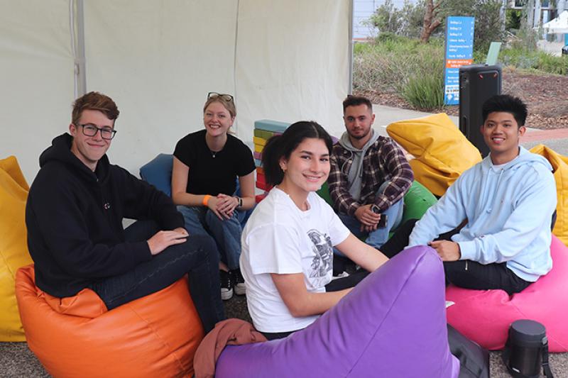 Students sitting on coloured beanbags at St Albans campus