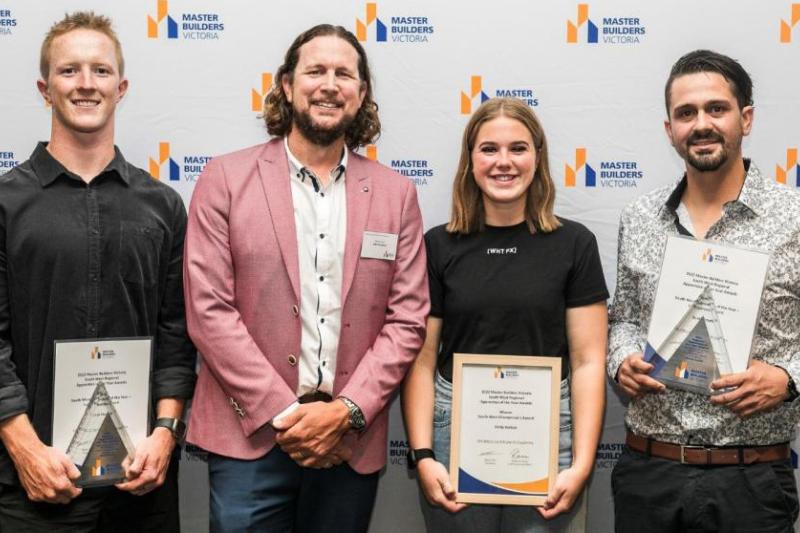 Jack and Emily posing with the presenter and third winner at the Master Builders Victoria Regional Apprentice of the Year Awards