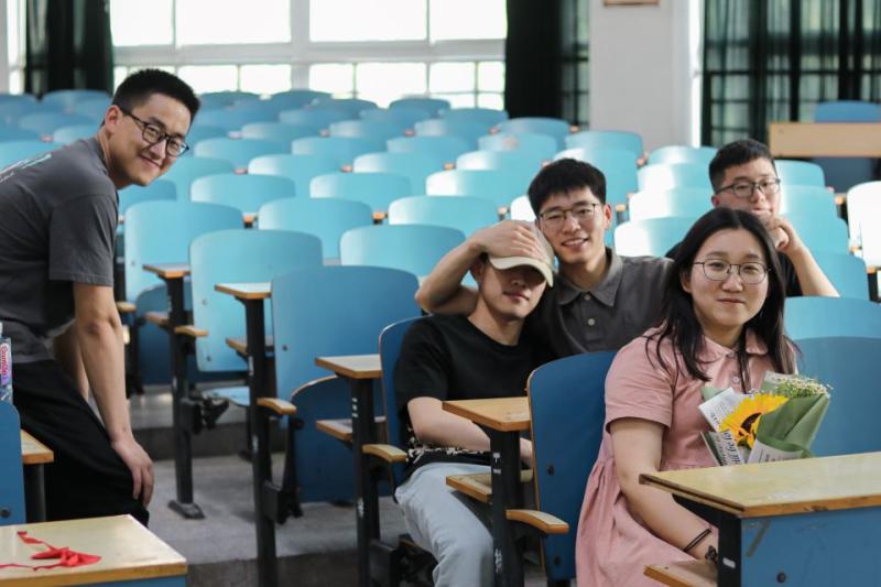 Small group of Chinese students in lecture theatre