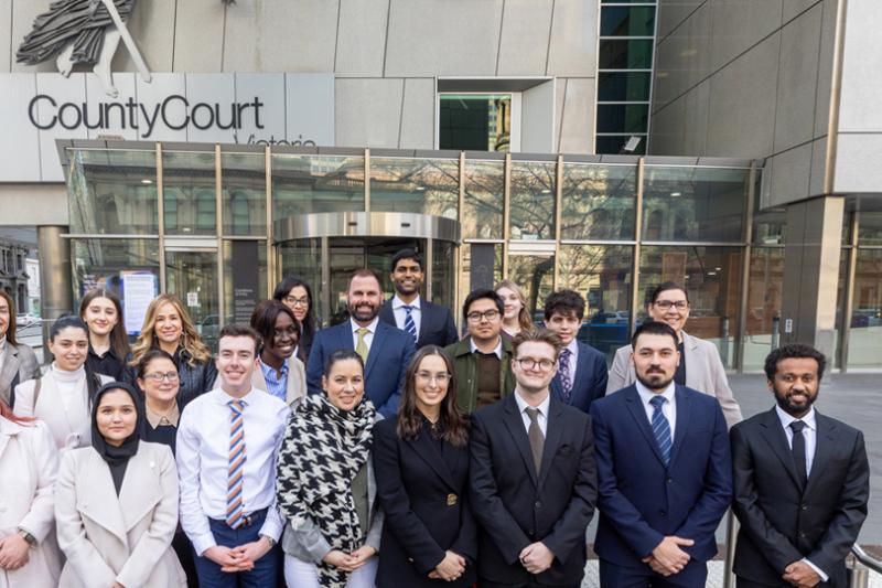 20 VU law students standing on the front steps of the County Court, Melbourne
