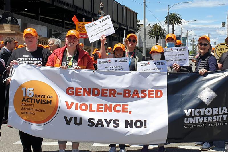 VU staff marching with banner for the 'Walk against family violence' as part of 16 Days of Activism.