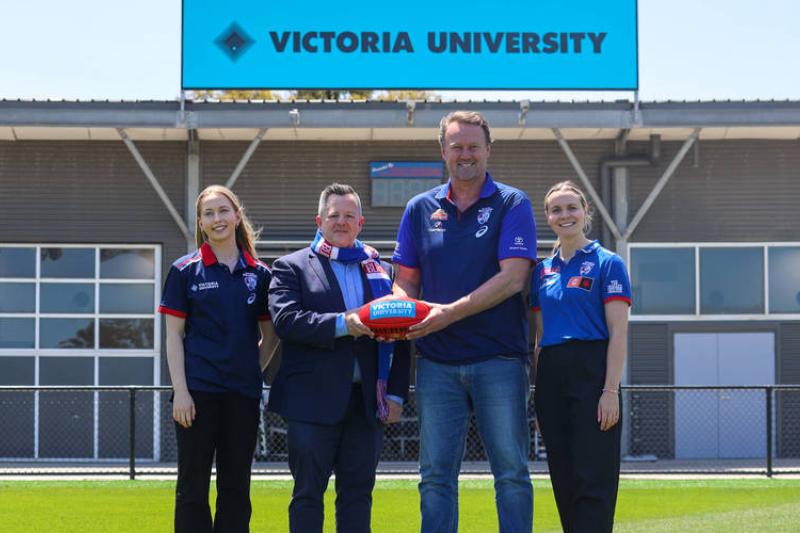 Group of people in front of VU high performance centre at Whitten Oval