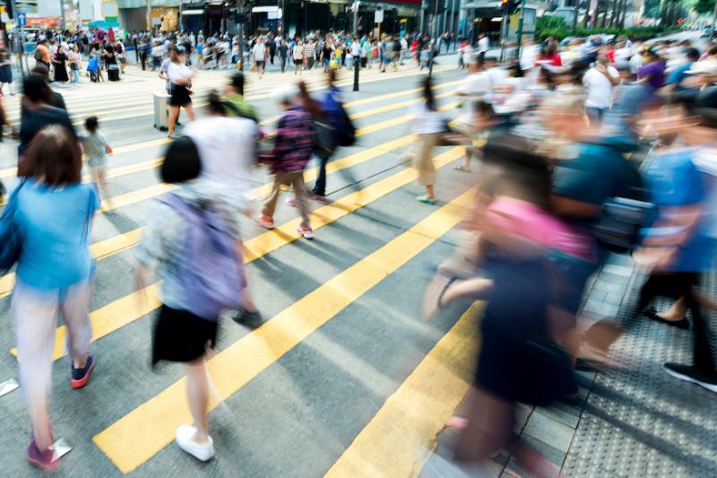 Crowd of people walking on busy Chinese street