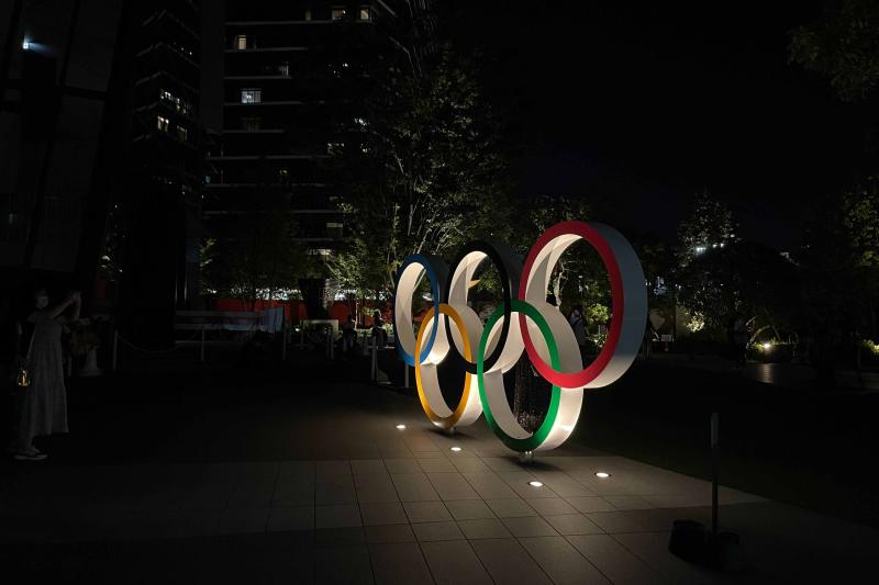Olympic rings statue at night