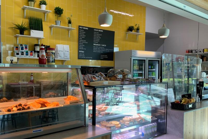A cafe with hot and cold food on display.